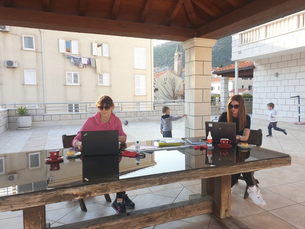 Vesna and Mia in their home office. Croatian style. If you look closerly you can see a meter distance between them and sanitizers at hand.