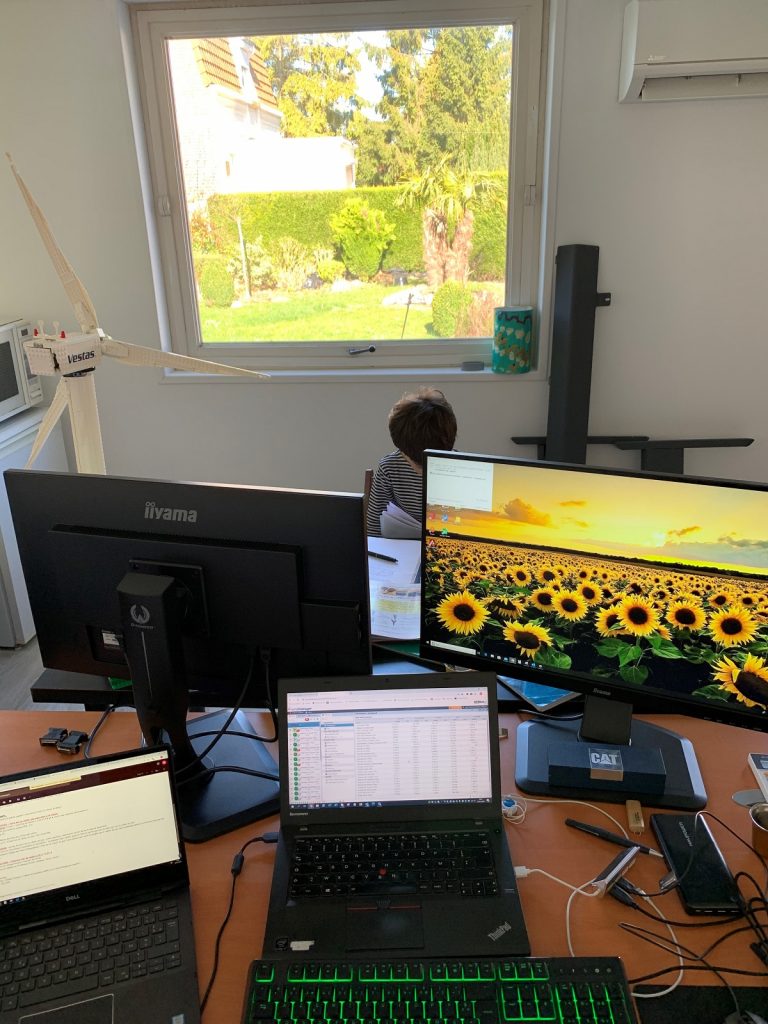 Mikael shares his French home office. With his gigantic Vestas turbine and his son.